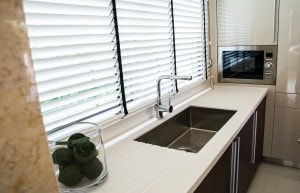 Water tap and sink in a modern kitchen interior